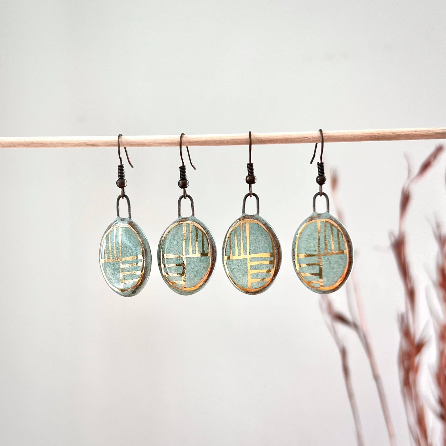 Turquoise Oval Earrings with Gold Lines